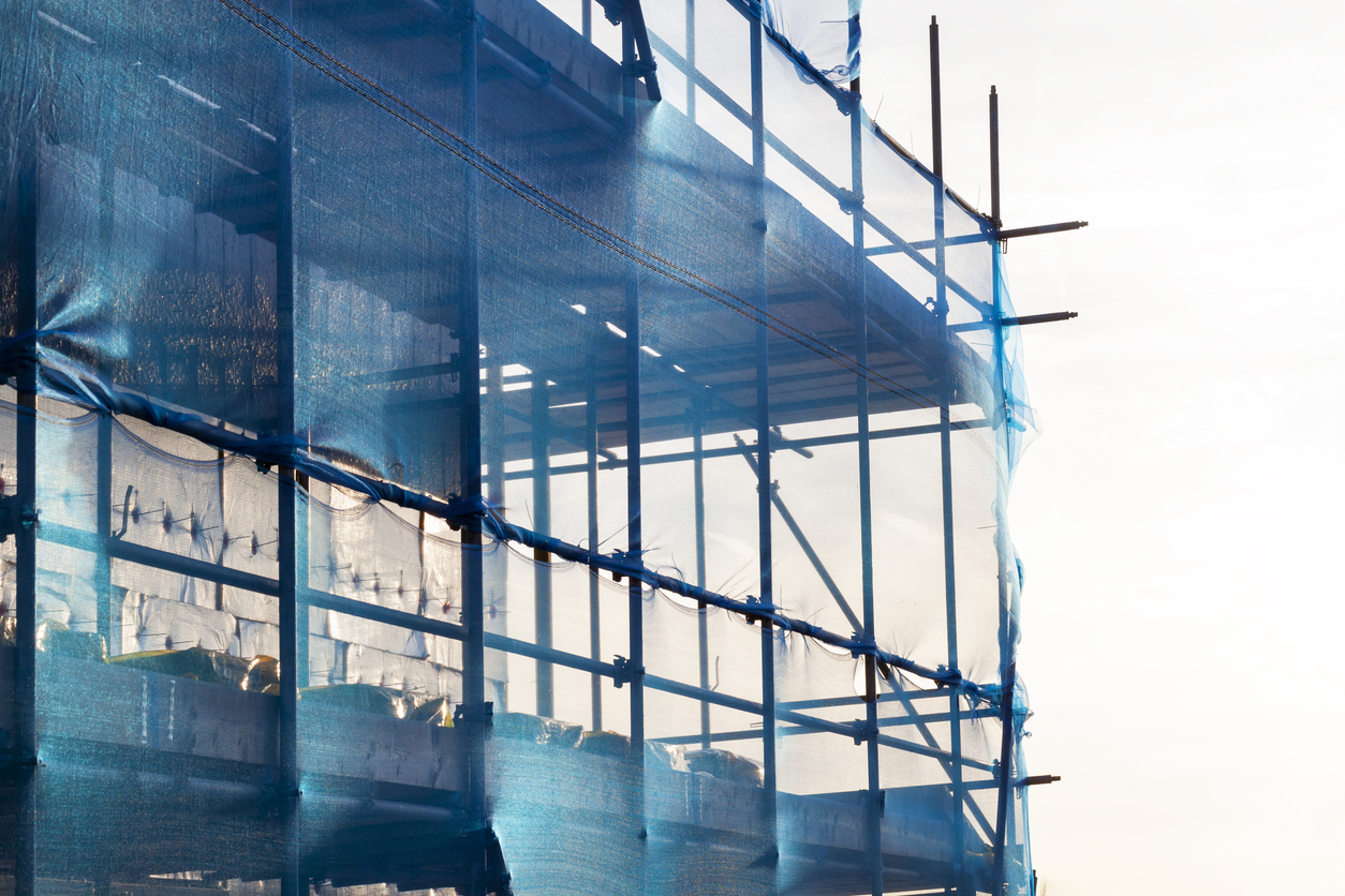 Blue scaffolding with safety netting